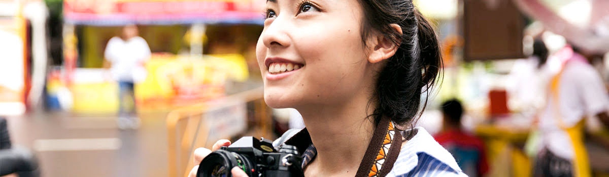 Girl sightseeing with camera