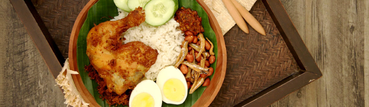 Dish of Malaysian chicken with rice and egg at upscale restaurant in Kuala Lumpur, Malaysia