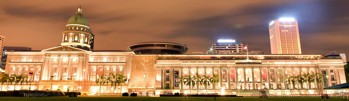 Lit front facade of the Supreme Court building in Singapore