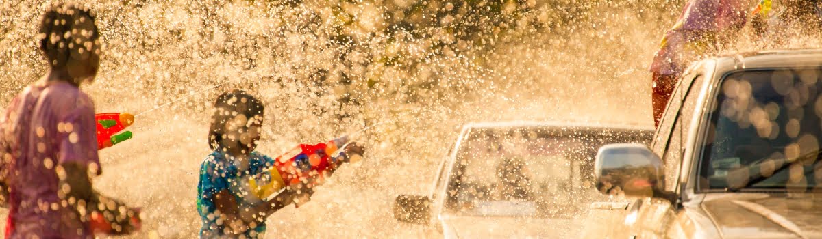 New Year in Asia-Featured photo- splashing water during Songkran