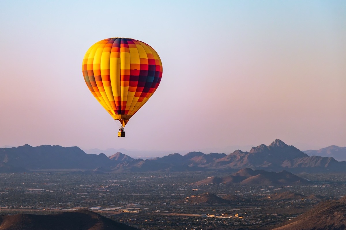 hot air balloon at sunrise over Phoenix sky