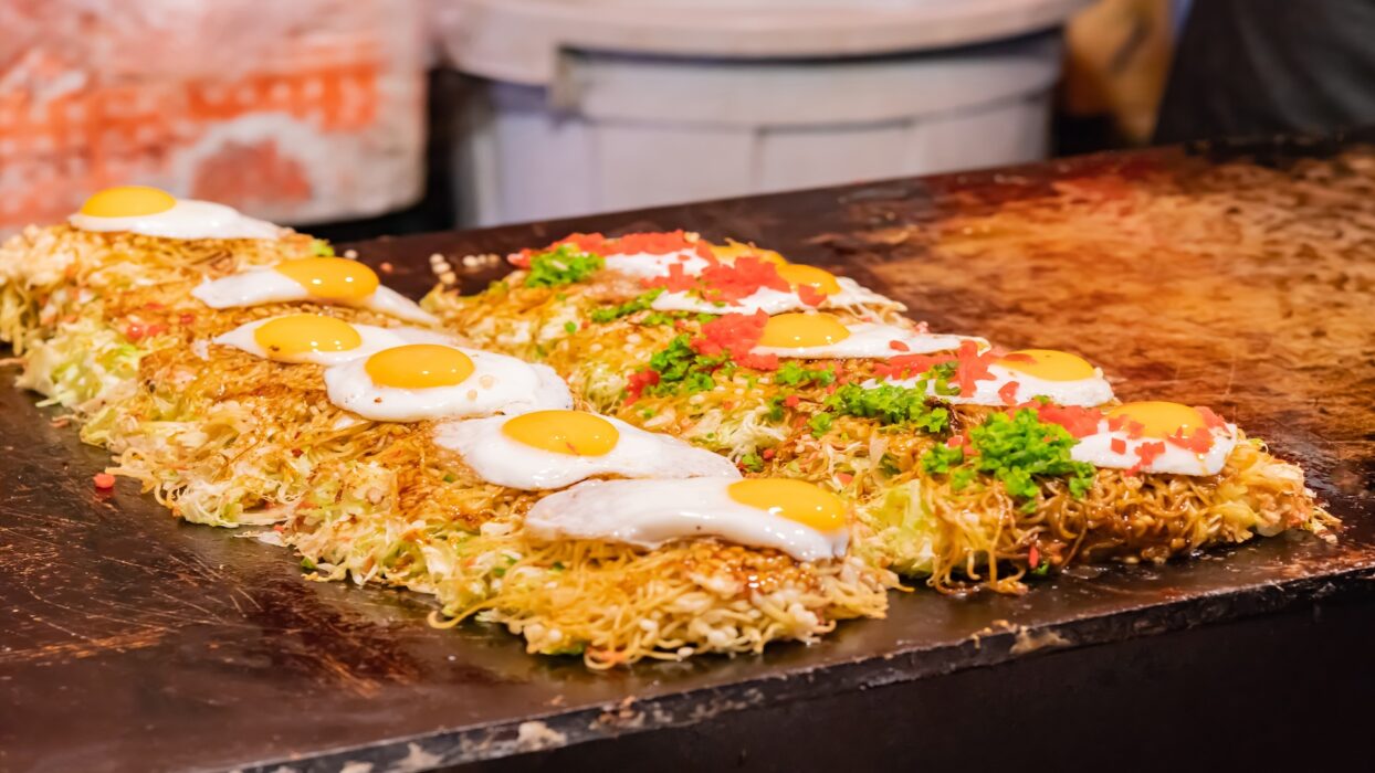 Savor the Flavors of Japan: Your Ultimate Guide to Okonomiyaki Adventures background image