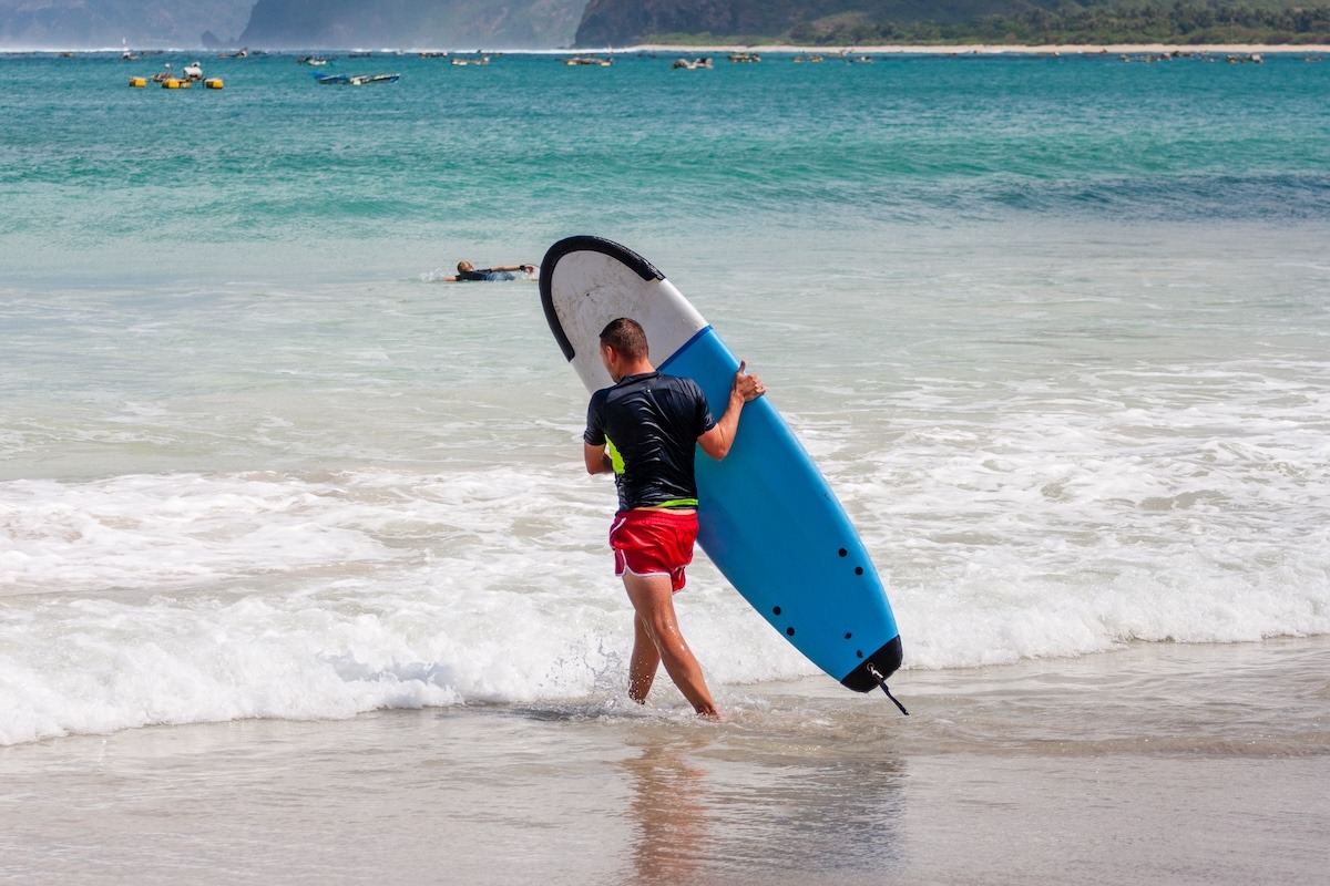 Surfing at Selong Belanak beach, Lombok, Indonesia Surfing at Selong Belanak beach, Lombok, Indonesia